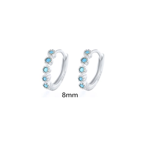 Detailed macro view of S925 sterling silver hoop earrings with blue stones and 8mm size mark