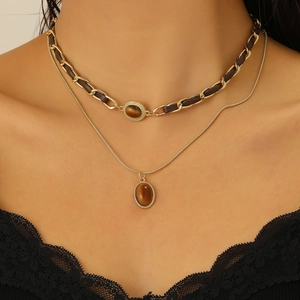Doppellagige Goldhalskette mit braunem Tigerauge und geflochtenem Choker in Dunkelbraun