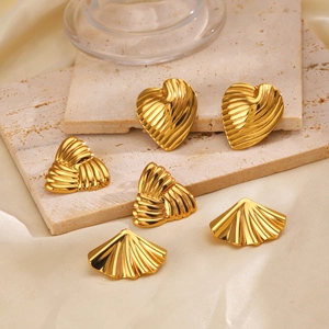 Chic gold geometric earrings set featuring heart, triangle, and shell shapes on silk