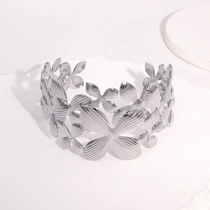 Bracciale rigido largo in acciaio inossidabile argento con gigli e farfalle traforati