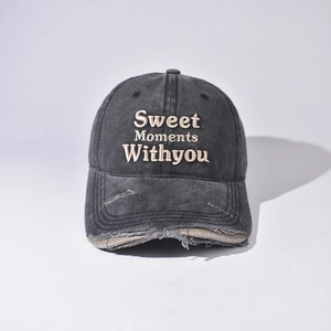 Close-up of vintage washed charcoal baseball cap with Sweet Moments WITHYOU embroidery