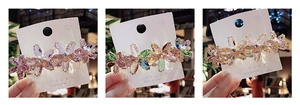 Detailed comparison of crystal flower hair clips in pink, multicolor, and champagne gold colors