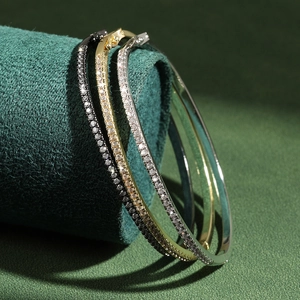Classic gold, silver, and black bangles with sparkling micro-pave cubic zirconia inlay