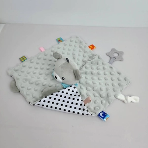Close-up of baby comforter with grey bear head, minky dot fabric, and star teether toy
