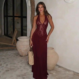 Detail of burgundy lace halter dress with backless design and satin splice finish