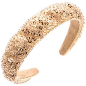 Close-up of handmade champagne gold beaded headband with sequins and wavy edges