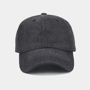 Close-up of dark grey denim baseball cap showing soft texture and vintage fabric detail