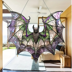 Close-up of a purple and green acrylic bat suncatcher with stained glass texture