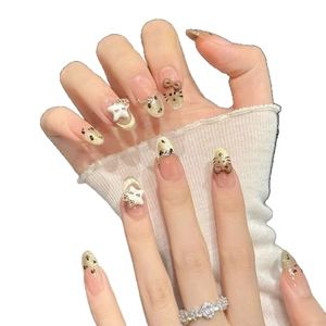 Handmade press-on nails with leopard print, French cat-eye glitter, and 3D star charms