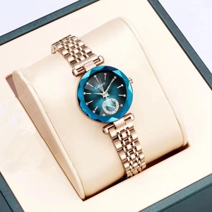 Elegant rose gold steel watch for women featuring a faceted blue dial in a gift box