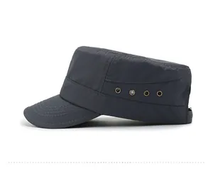 Detail view of dark grey flat top cap showing metal eyelets and breathable fabric