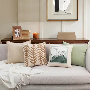 Modern Nordic decorative pillow covers with embroidery on a cozy grey sofa setup