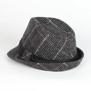 Detail of British style wool fedora hat featuring black and grey plaid and leather band