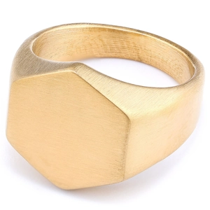 Minimalist gold hexagonal signet ring with a brushed matte finish on a white background