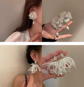 Detail shots of floral lace earrings with pearls and long tassel drop earrings with crystals