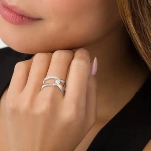 Elegant S925 sterling silver knot ring featuring pavé cubic zirconia in a minimalist style