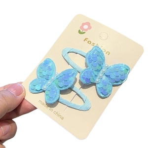 Sparkly light blue sequin butterfly hair clips with pearl detail for girls