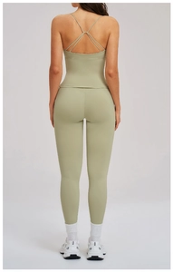 Back view of sage green yoga set with criss-cross straps and high waist leggings