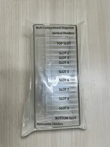 Macro view of clear acrylic jewelry storage box with individual compartment slots