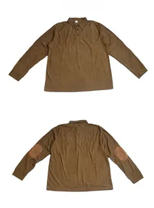 Detailed view of brown corduroy polo shirt with three-button placket and elbow patches