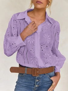 Detailed view of purple eyelet embroidery and hollow out puff sleeves on the shirt