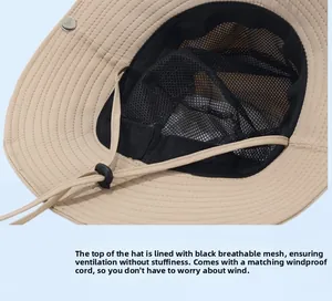 Detail of beige sun hat featuring black breathable mesh lining and adjustable chin strap