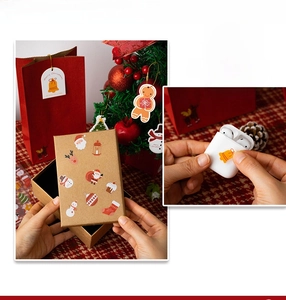 Macro view of cute cartoon Christmas stickers on gift boxes and holiday gift bags