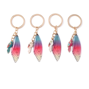 Elegant bird wing keychain with enamel bird pendant and translucent gradient charms
