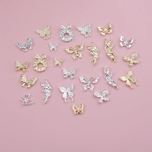 Mix of 3D gold and silver butterfly nail charms with hollow and rhinestone details