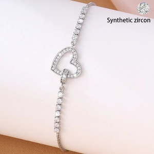 Sparkling silver heart bracelet with synthetic zircon accents on a clean white background