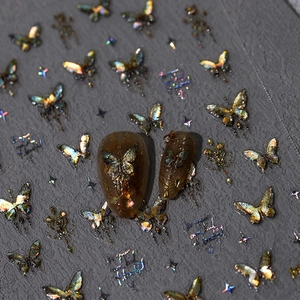 Laser holographic butterfly nail stickers with 3D metallic gold starburst patterns