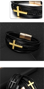 Macro detail of men's layered leather bracelet with gold cross and magnetic clasp