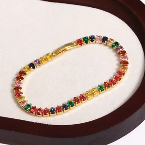 Detail of multi-color pear-cut tennis bracelet with gold-plated claws and fold-over clasp