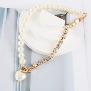 Asymmetric faux pearl and rhinestone necklace with golden heart pendant and OT toggle clasp