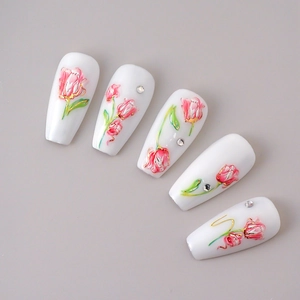 Detail of pink tulip nail art stickers with 3D embossed texture and sparkling rhinestones