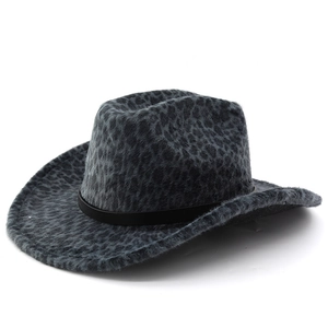 Macro detail of the leopard print texture and black leather strap on the western cowboy hat