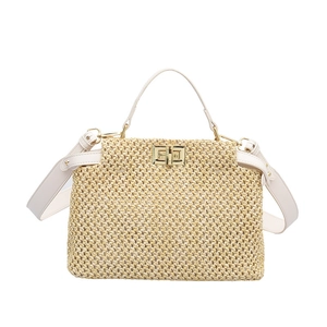 Straw woven tote bag with beige leather handles and gold clasp for summer beach style
