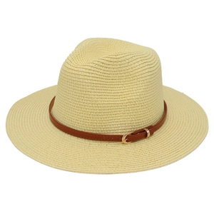 Detailed texture of beige woven Panama hat with a brown leather strap and gold buckle