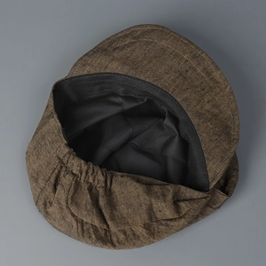 Deep brown textured linen newsboy hat with elastic back and structured brim overview