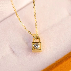 18K gold square padlock pendant necklace with single diamond on pink jewelry box