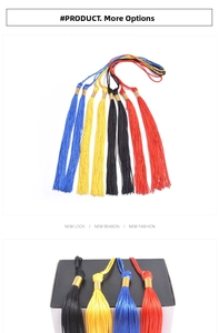 Detail of graduation cap tassels in red, black, yellow, and blue with gold charms