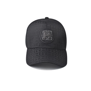 Detailed embroidery of circular H logo on black checkered mesh baseball cap