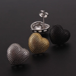 Minimalist 18k gold plated heart stud earrings set in gold, silver, and black finishes