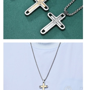 Macro shot of two-tone double layer cross necklaces with stone setting and metal chains