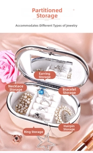 White PU leather oval jewelry box featuring multi-slot storage and built-in vanity mirror