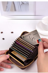 Brown accordion card holder with multi-layer slots and metallic zipper detail