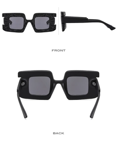 Detailed views of black oversized square sunglasses with unique carved textured frames