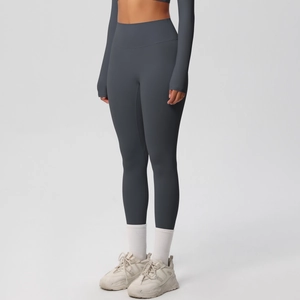 Detail of high-waisted seamless yoga leggings and long sleeve crop top with thumbholes
