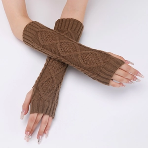 Detailed knit texture of long brown fingerless gloves with diamond crochet pattern
