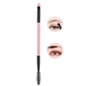 Dual-ended pink wood eyebrow brush and black spoolie for professional eye makeup grooming